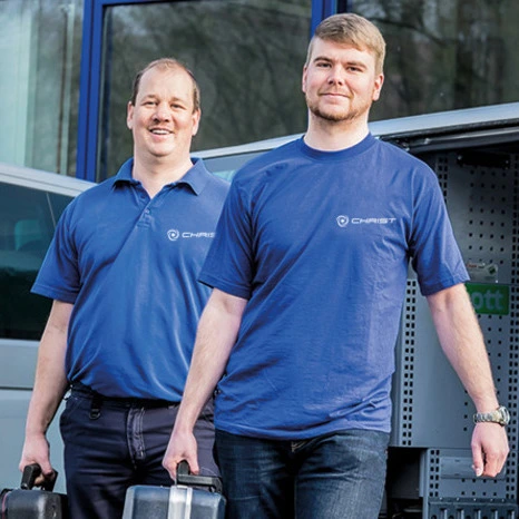 BeScientific team members walking with tools